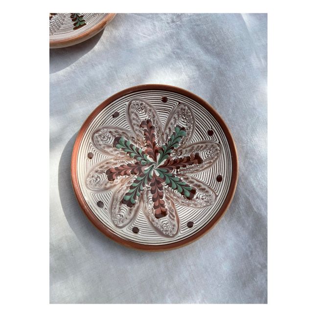 Plato de cerámica con motivos florales y lunares
