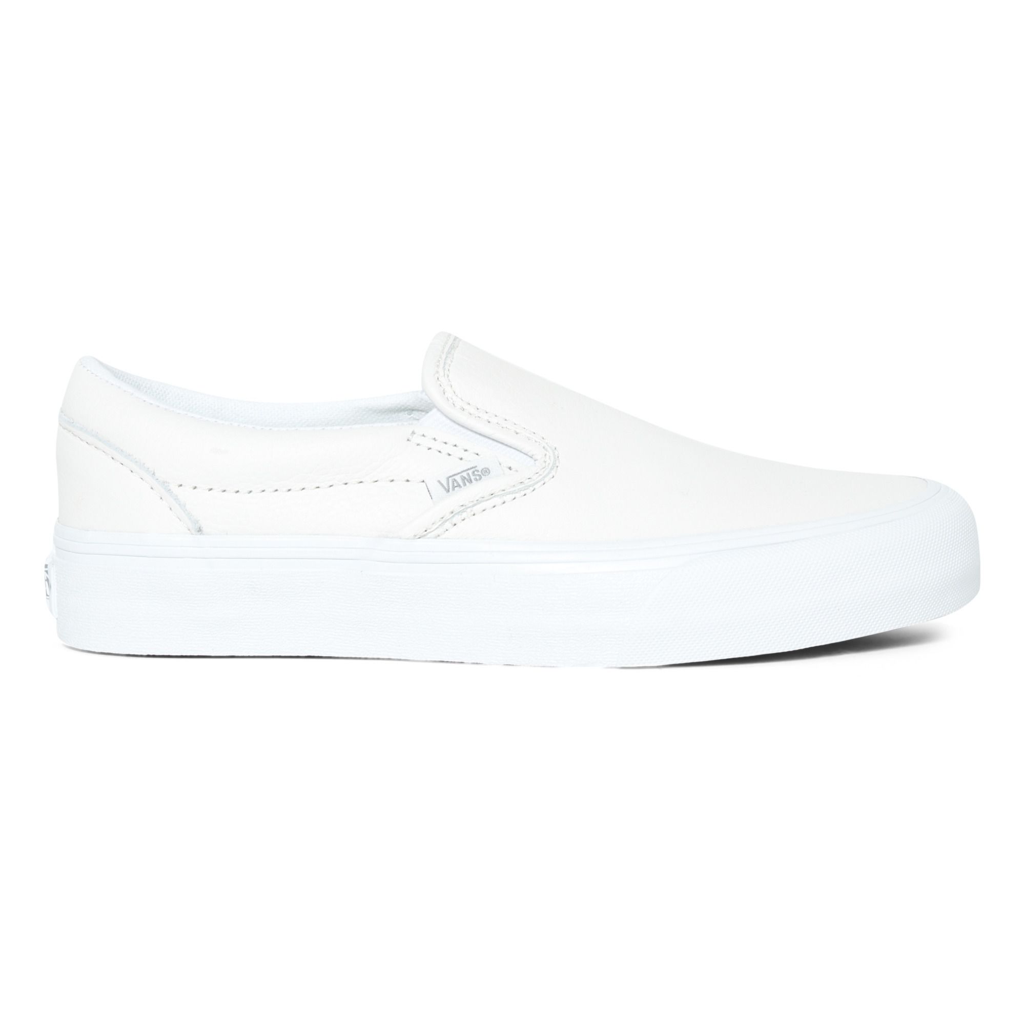 Solid white vans hot sale slip ons