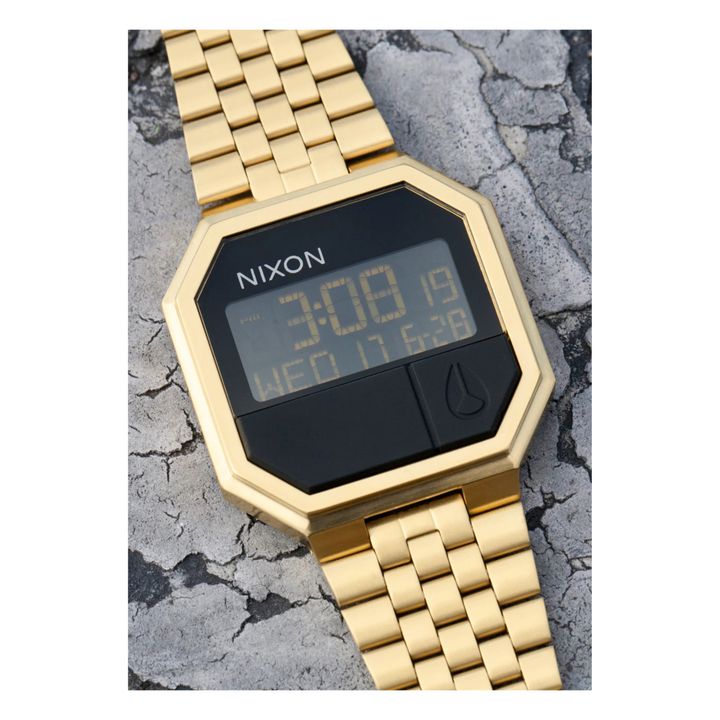 Reloj nixon 2025 re run dorado